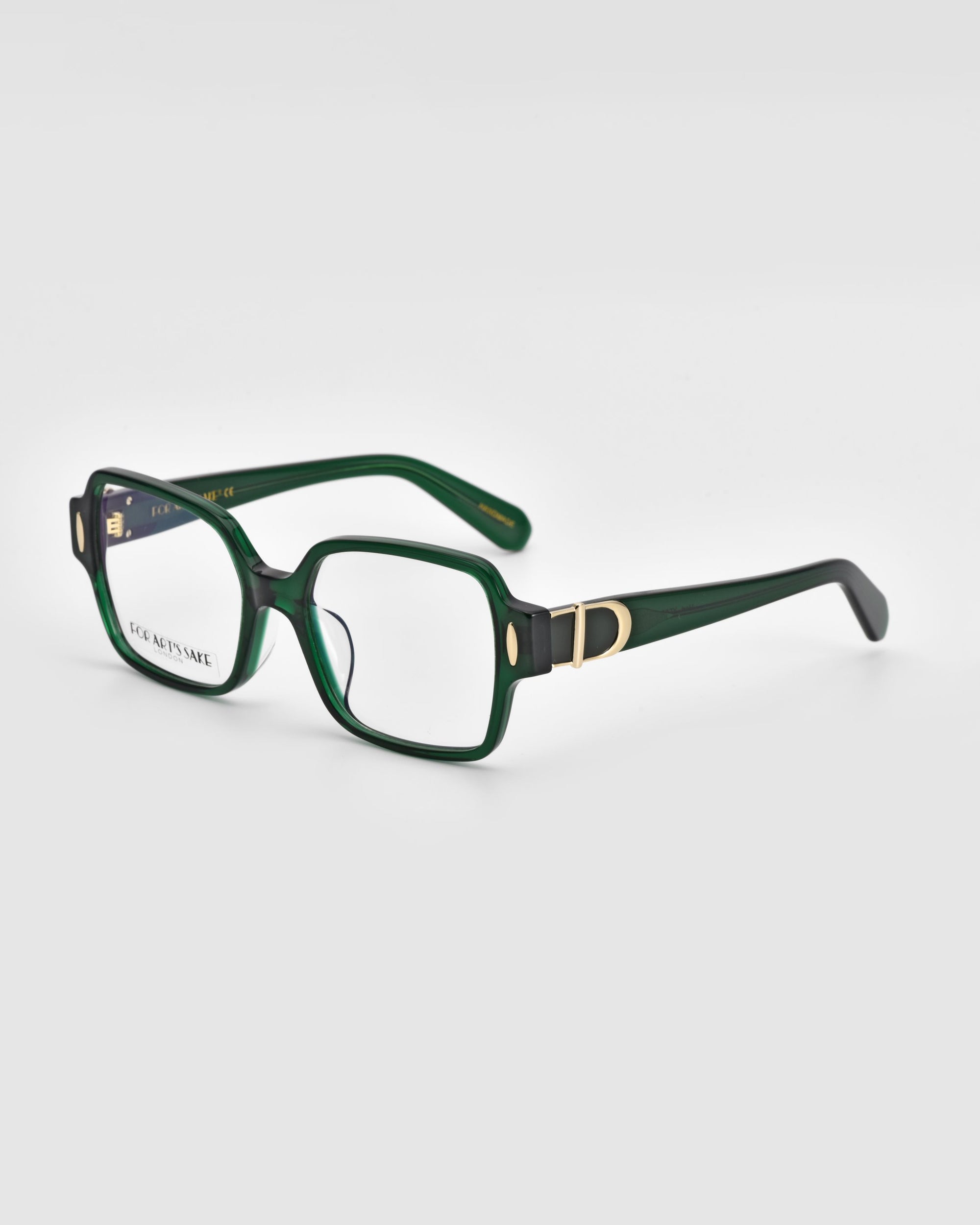 A pair of Hart eyeglasses by For Art&#39;s Sake® features green rectangular frames with thick borders, adorned with a &quot;D&quot; logo on the temples. The clear lenses have a subtle reflection, highlighting their pristine surface. Showcasing a classic design, these glasses are set against a white background and angled slightly to the left.