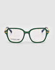 A pair of Delight rectangular green eyeglasses with gold detailing on the upper corners of the frames evoke a vintage charm infused with modern sophistication. The glasses sit against a plain white background, and the inside of the left lens displays the text "For Art's Sake® London.