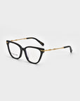 A pair of black rectangular eyeglasses from For Art's Sake®'s Lexie collection is displayed against a white background. The design features gold accents on the temples and clear lenses, with one lens showcasing a small printed text detail from Lexie Opticals, giving it a sleek and chic aesthetic.