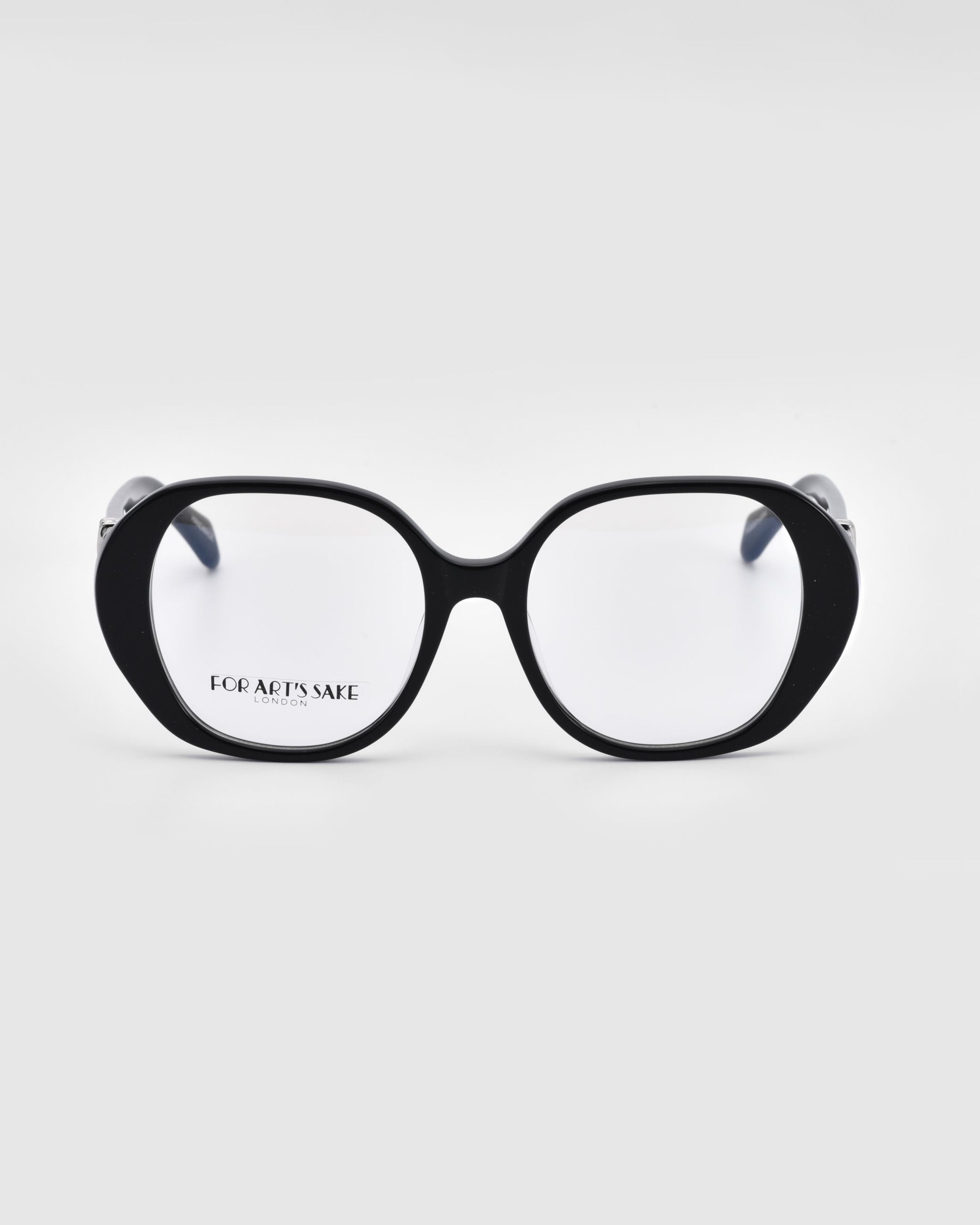 A pair of bold and stylish black eyeglasses named "Bow" by For Art's Sake®, featuring oversized rectangular lenses with rounded edges against a white background. Crafted from biodegradable acetate, the inside of the left lens displays the brand name "For Art's Sake®" in small text.