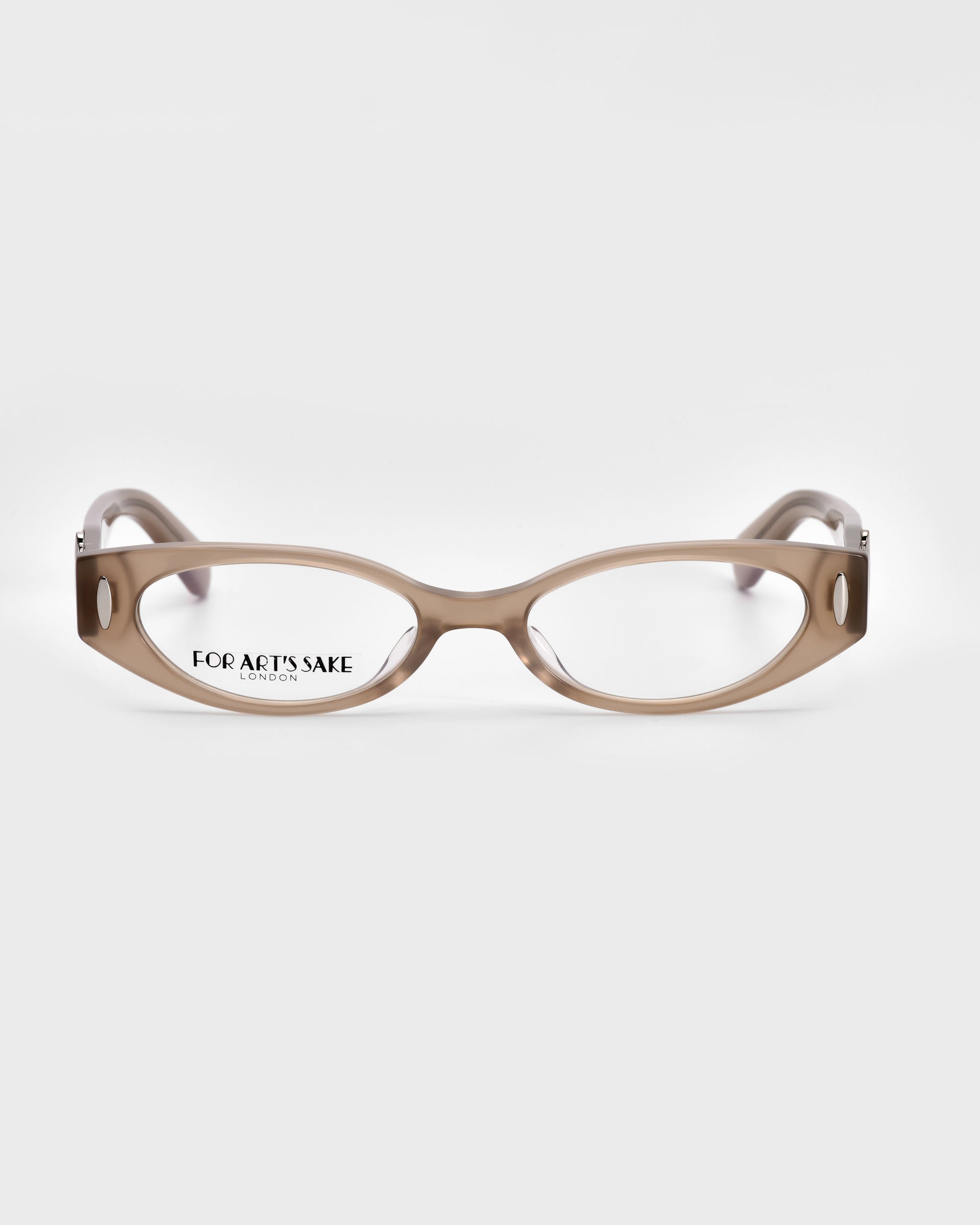 A pair of light brown rectangular Cigar eyeglasses from For Art&#39;s Sake®, featuring rounded frames and wide arms that exude vintage charm. The transparent areas on the frames beautifully showcase the polished acetate temples. The words &quot;FOR ARTS SAKE&quot; are printed on the inside of the right lens, all set against a plain white background.