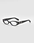 A pair of black rectangular eyeglasses with clear lenses exuding vintage charm. The frames, adorned with silver accents on the temples near the hinges, blend sophistication and style. Made from polished acetate, the Cigar frames by For Art's Sake® stand out against the plain light gray background.