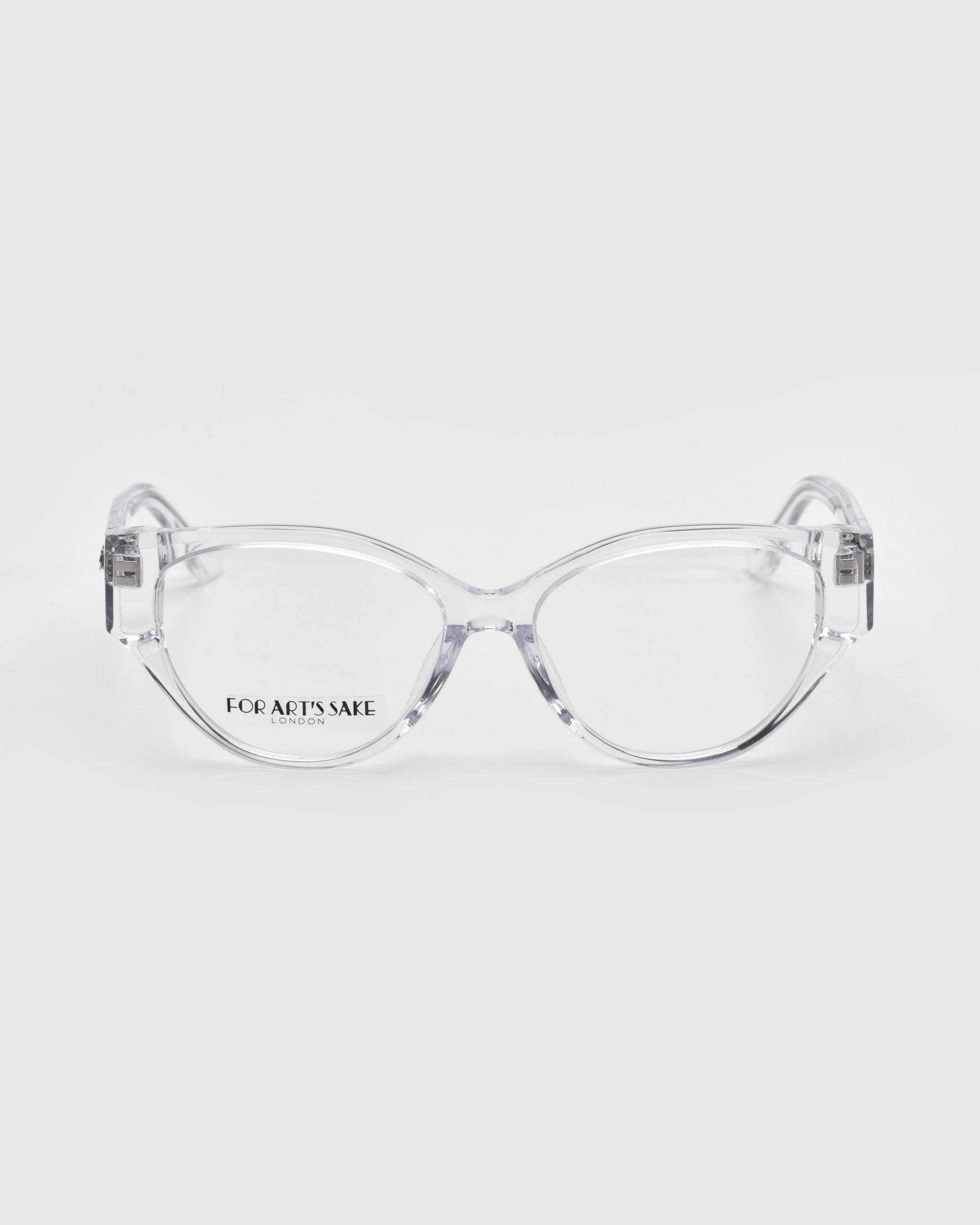 Clear-framed cat-eye Rosalia I eyeglasses from the Rose Garden Collection are displayed against a plain background, exuding elegance and femininity, with "For Art's Sake®" visible on the left lens.