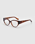 The Rosalia I eyeglasses from For Art's Sake® feature rectangular lenses with thick tortoiseshell frames. A subtle logo on the temples enhances their classic yet bold design, exuding timeless elegance against a plain background.