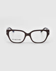 A pair of rectangular black eyeglasses with slightly curved arms from the Rose Garden collection is shown on a white background. "For Art’s Sake® LONDON" appears on the left lens, merging sophisticated style with artistic flair. The product name is Eros.