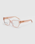 The Eros eyeglasses by For Art's Sake® feature a chic cat-eye acetate frame in transparent pink with clear lenses, elegantly displayed on a simple white background.