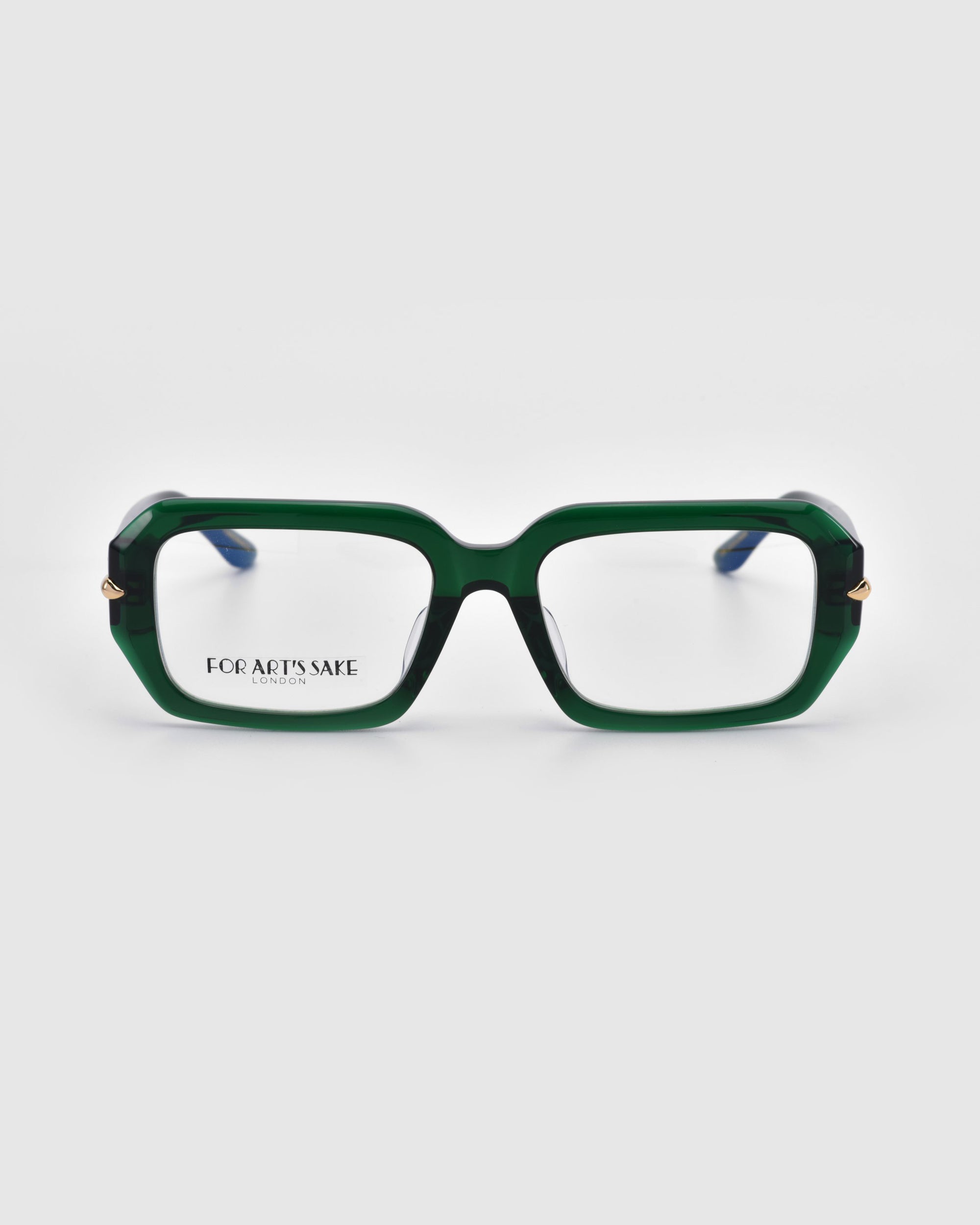 The "Petal" by For Art's Sake® is a pair of rectangular glasses with chunky acetate frames featuring vivid green fronts and dark temples. The brand name is elegantly scripted on the left clear lens, blending style and subtlety in everyday eyewear against a white background.