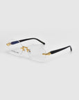 Hampton hexagonal eyeglasses by For Art's Sake® showcase clear lenses, thin gold rims, and black temples. Part of the Rose Garden collection, they feature decorative gold accents on the bridge and temple tips for a stylish modern look.