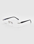 From For Art's Sake® Claremont collection, these rimless eyeglasses feature rectangular clear lenses, thin black temples, and silver accents against a white backdrop, highlighting the elegant design.