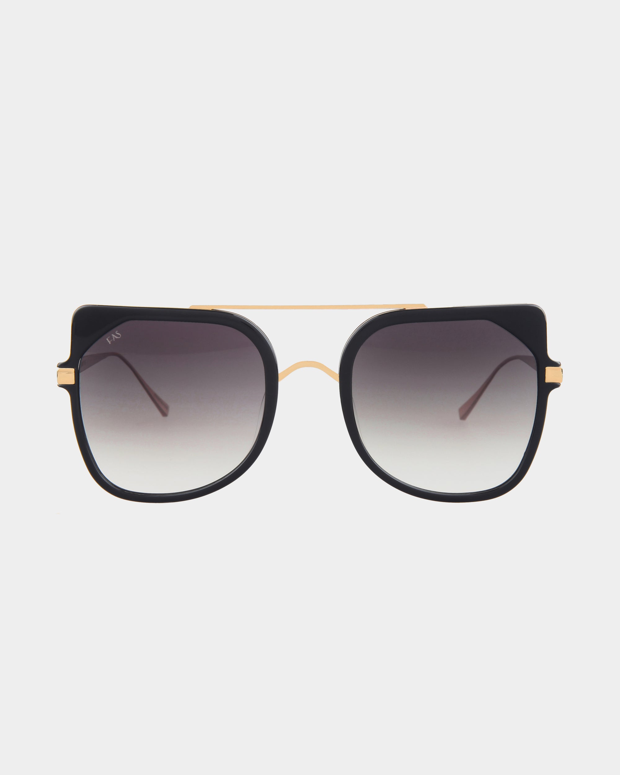 The Big Game by For Art's Sake® are a pair of oversized, square-shaped sunglasses featuring a black stainless steel frame with gradient lenses. These sunglasses boast a gold-colored bridge and delicate gold accents on the sides. The lenses provide UV protection, transitioning from dark at the top to lighter at the bottom.