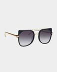 For Art's Sake® Big Game sunglasses feature a sleek aviator-style design with dark, gradient nylon lenses, a black upper frame, and gold accents. The thin gold bridge and temples add a modern and stylish touch while providing UV protection. The gradient lenses transition from dark at the top to lighter at the bottom.