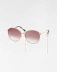 A pair of stylish For Art's Sake® Yoyo sunglasses with gradient brown lenses and 18k gold plating. Attached to the sunglasses are elegant chains adorned with freshwater pearls, hanging from both sides of the frame. The For Art's Sake® Yoyo sunglasses are isolated on a white background for a sophisticated look.
