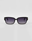 A pair of black rectangular Zenith sunglasses with gradient dark-to-light lenses. The handcrafted acetate frames feature two small gold-colored dots at the top corners of each lens. The background is plain white.

Product Name: Zenith
Brand Name: For Art's Sake®

Updated Sentence:
A pair of black rectangular For Art's Sake® Zenith sunglasses with gradient dark-to-light lenses. The handcrafted acetate frames feature two small gold-colored dots at the top corners of each lens. The background is plain white.