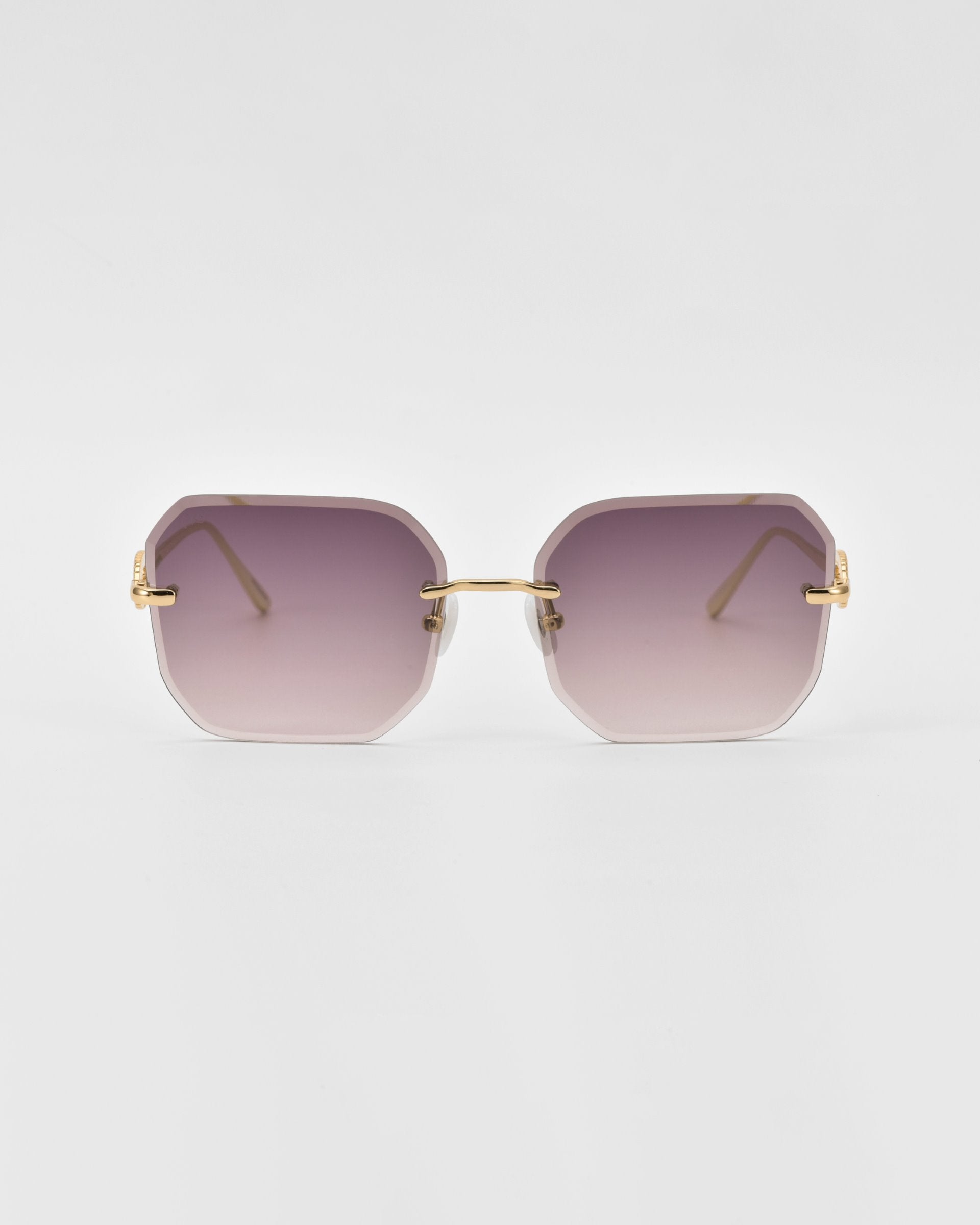 Introducing the For Art&#39;s Sake® Aria sunglasses, a pair of stylish, rimless shades with purple gradient lenses and gold temples. The design features geometric, slightly rounded square lenses and jade-stone nose pads for added comfort.