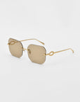 A pair of stylish For Art's Sake® Aria sunglasses with rimless, square diamond-cut lenses and gold-toned metal arms. The sunglasses feature a minimalist design with an elegant loop detail at the temple, adding a touch of luxury. The lenses have a light brown tint, complemented by jade-stone nose pads.