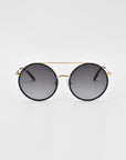 A pair of For Art's Sake® Orb oversized round aviator sunglasses with dark gradient lenses and a thin gold frame. The design features a distinct double bridge and black arms with gold accents at the hinges, complemented by jade-stone nose pads. The background is plain white, highlighting the stylish and modern design.