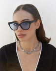 Crocodile Sunglasses, Blue. Image on a model. 